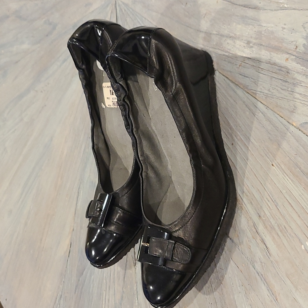 Stuart Weitzman black leather with patent leather wedge heels